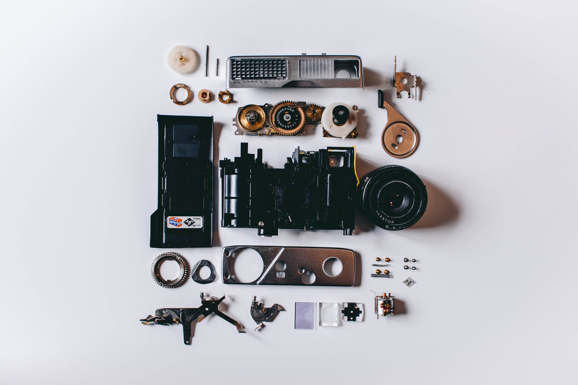 flat lay photography of parts of camera